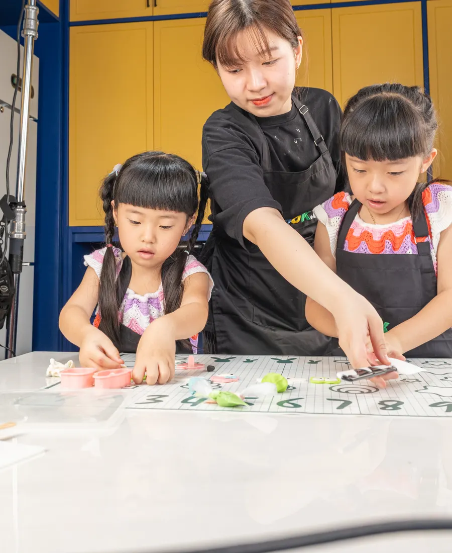 A class working together at the yellow kitchen