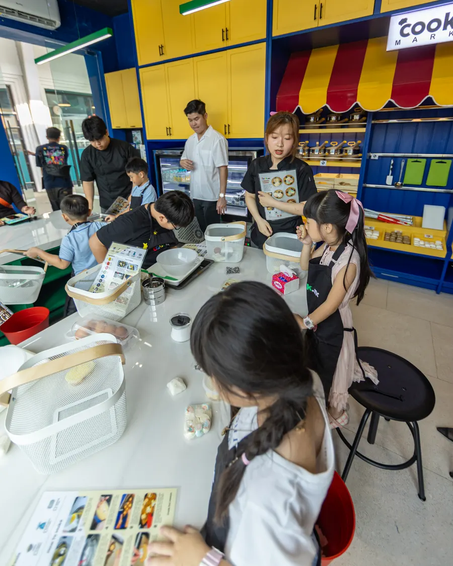 Children choosing ingredients from the display shelves