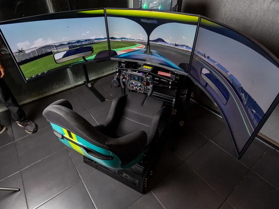 A Race.inc rig from behind, its three screens curved around the seat